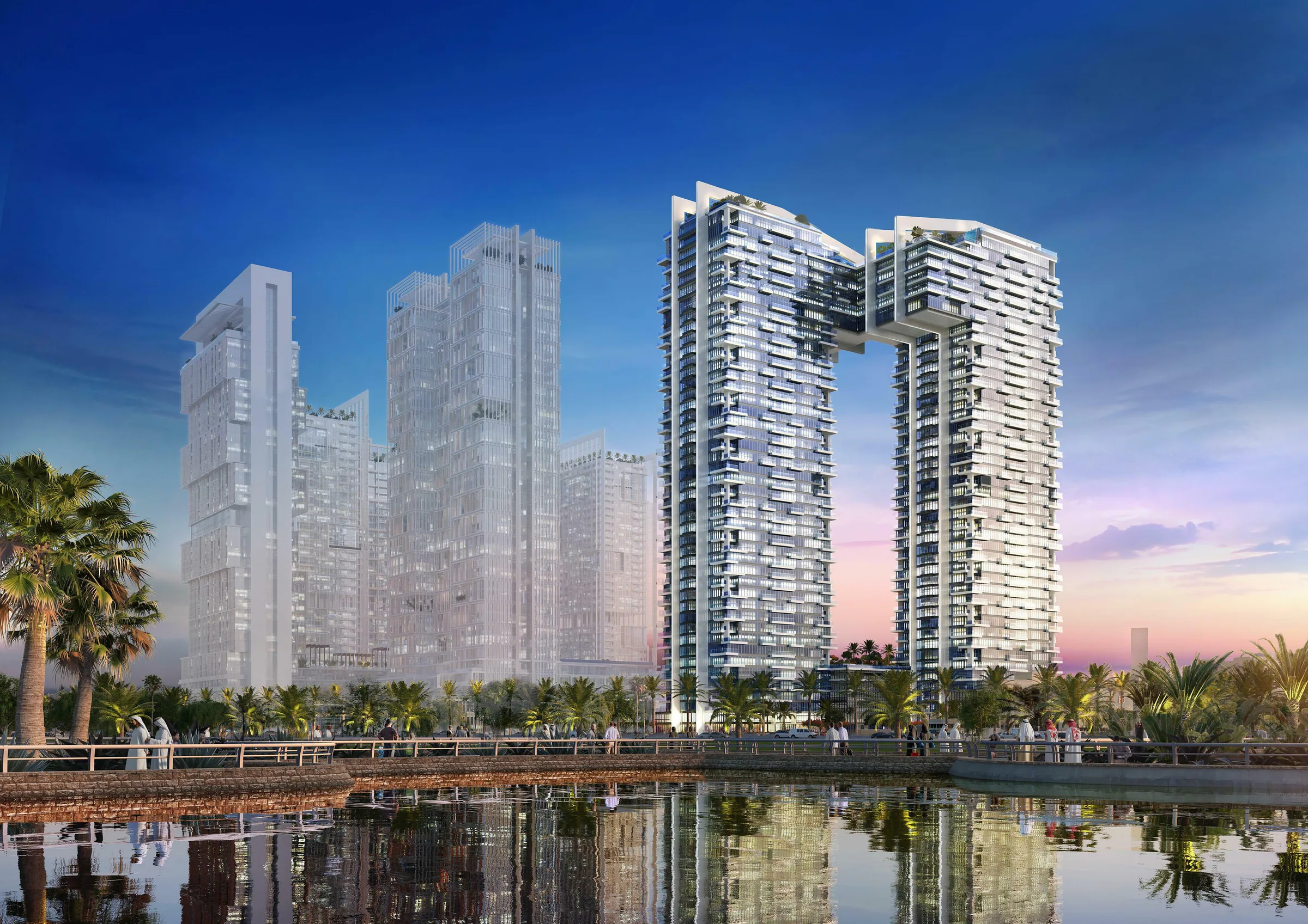 Две башни 1 Residences вечером, отражение в воде