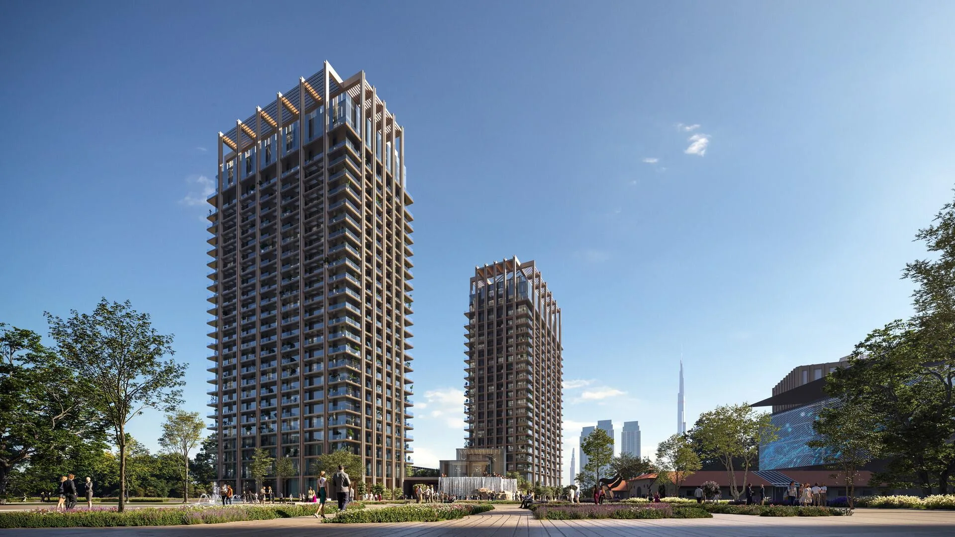 Башни The Residences над сквером с цветниками и водопадом