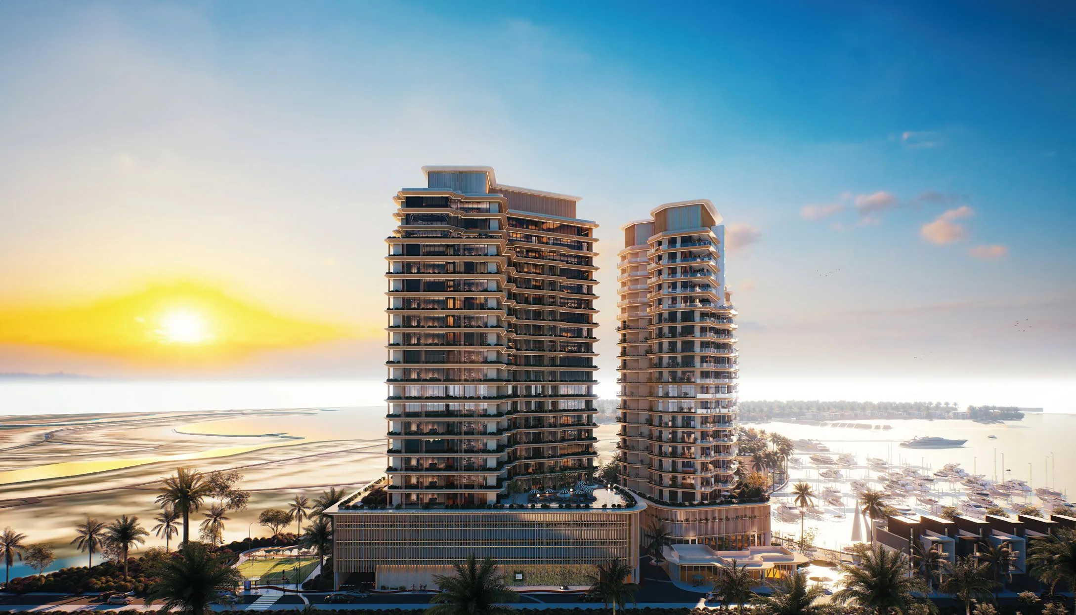 Башни Al Hamra Waterfront на закате, вид со стороны моря