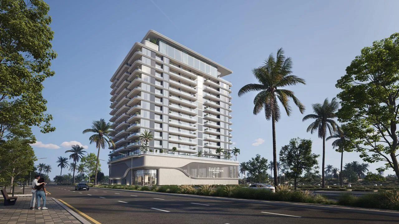 Omya Residences со стороны улицы: дорога, тротуар и пальмы