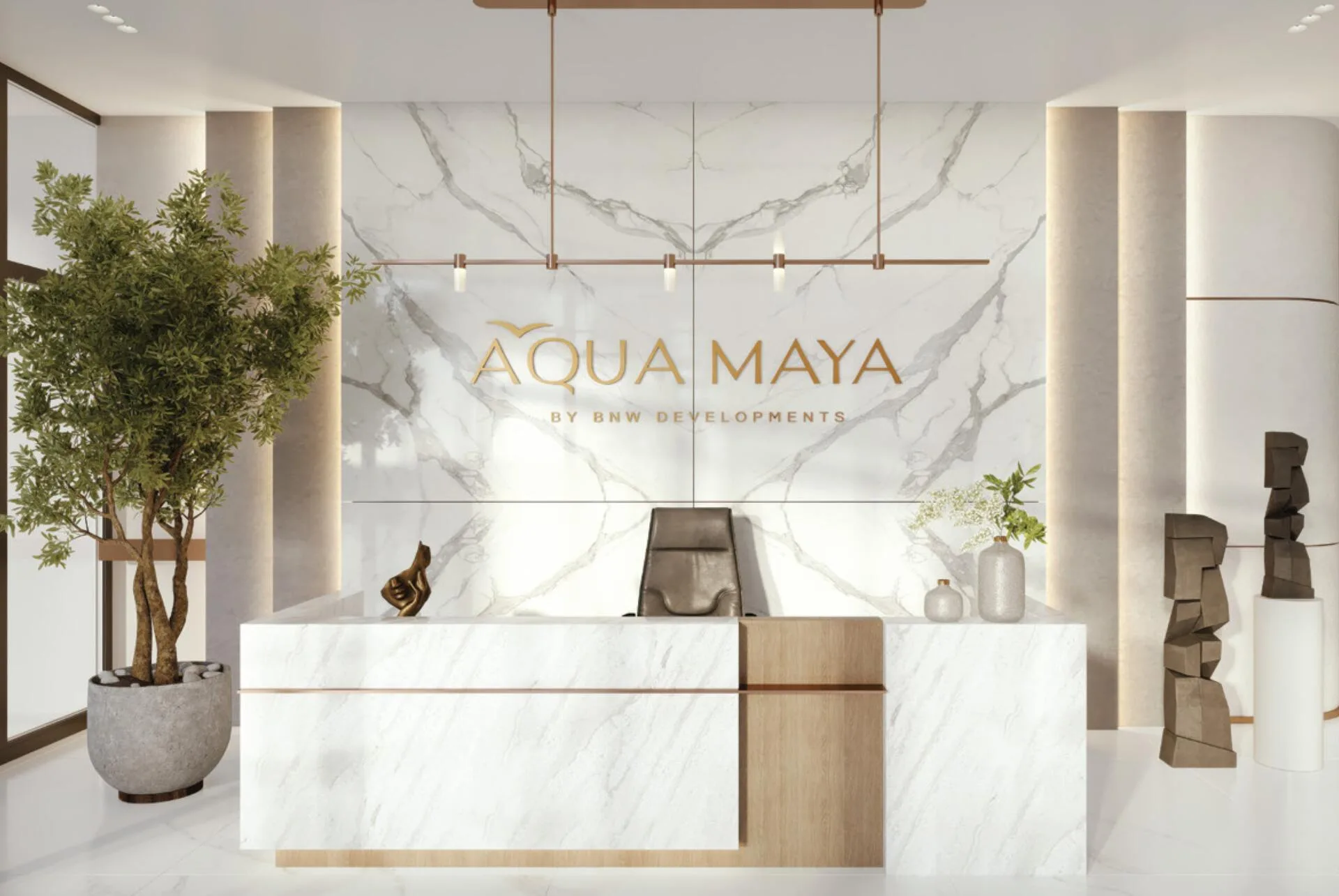 Ресепшен Aqua Maya с мраморной стеной и знаком дома