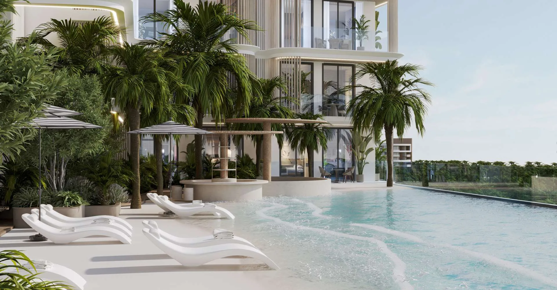 Пляжный клуб Arthouse Residences: шезлонги на песке у бассейна с пологим входом