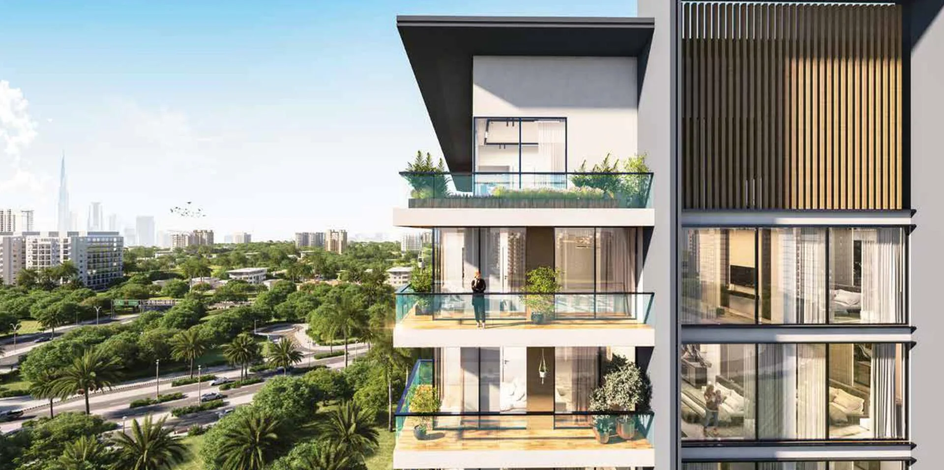Балконы верхних этажей Aum 99 Residences и вид на зелёный район