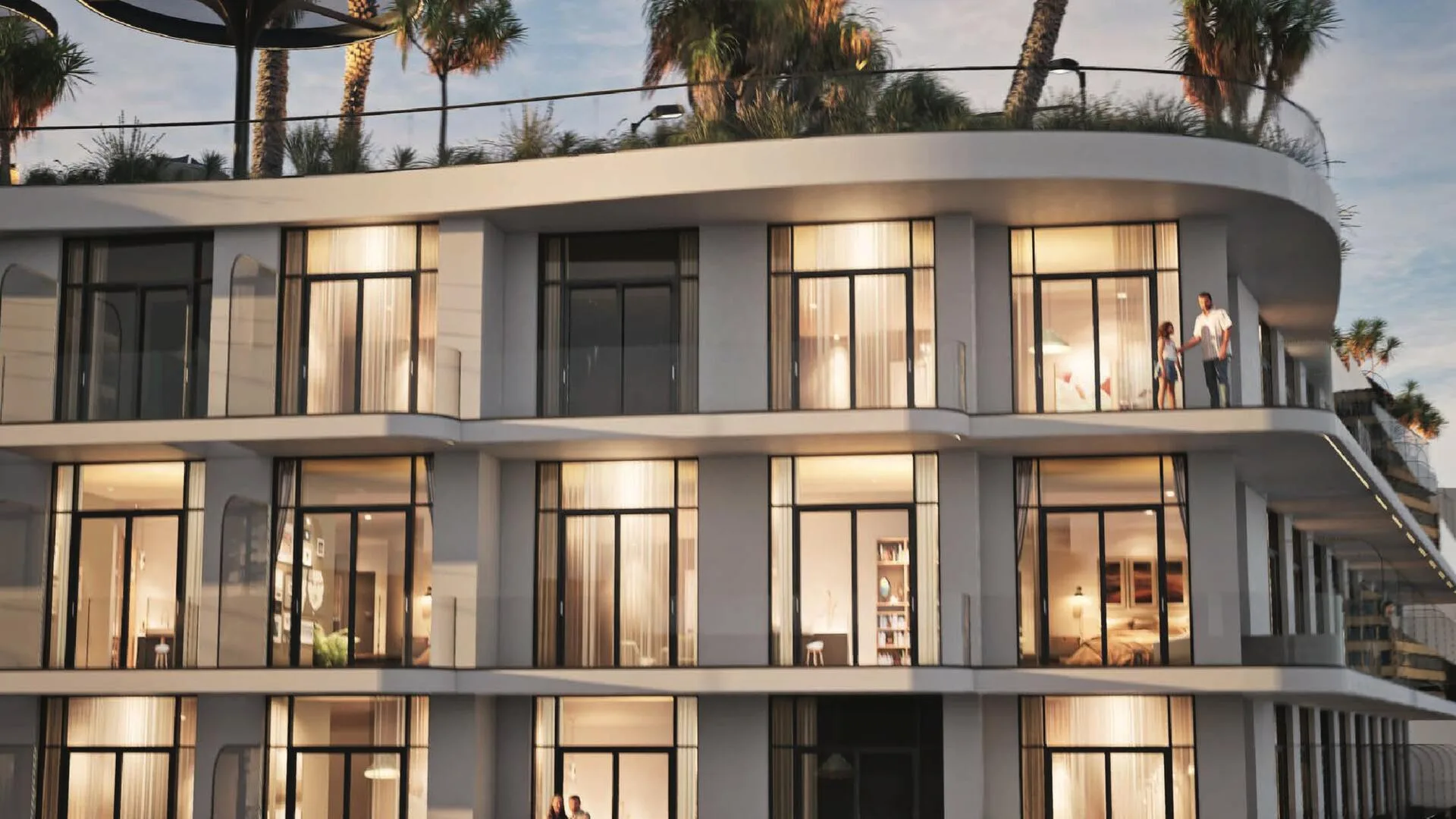 Окна от пола до потолка и балконы Avana Residences вечером