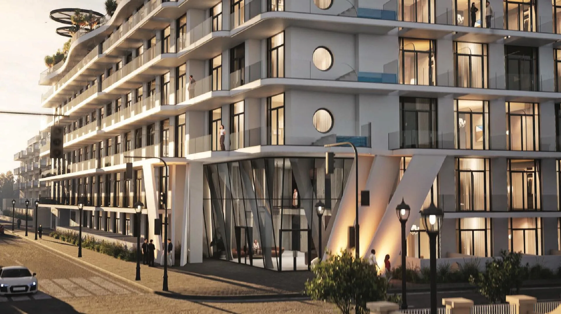 Улица и вход в Avana Residences вечером