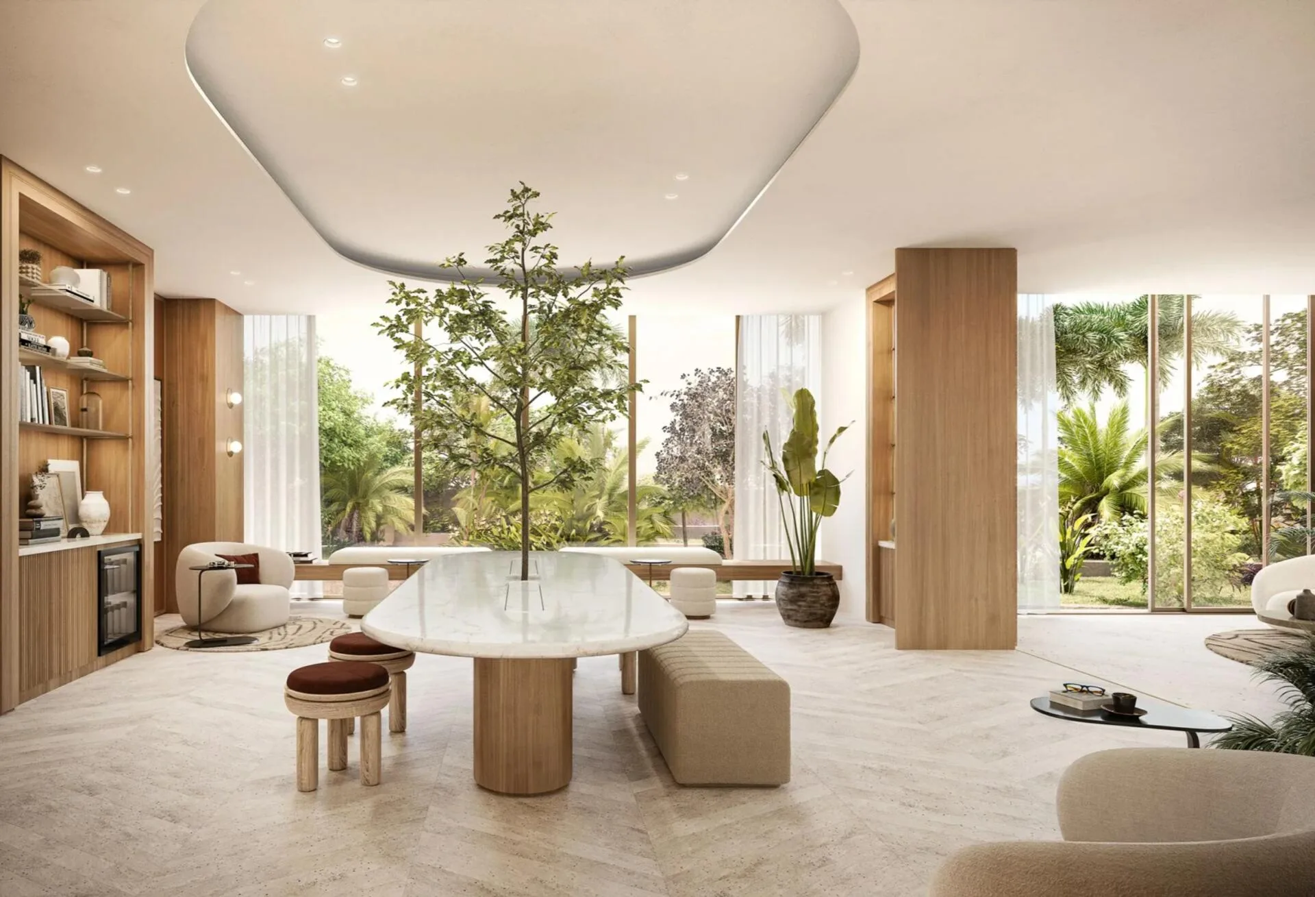Лобби Ellington Beach House: длинный стол с деревом посередине и окна в сад
