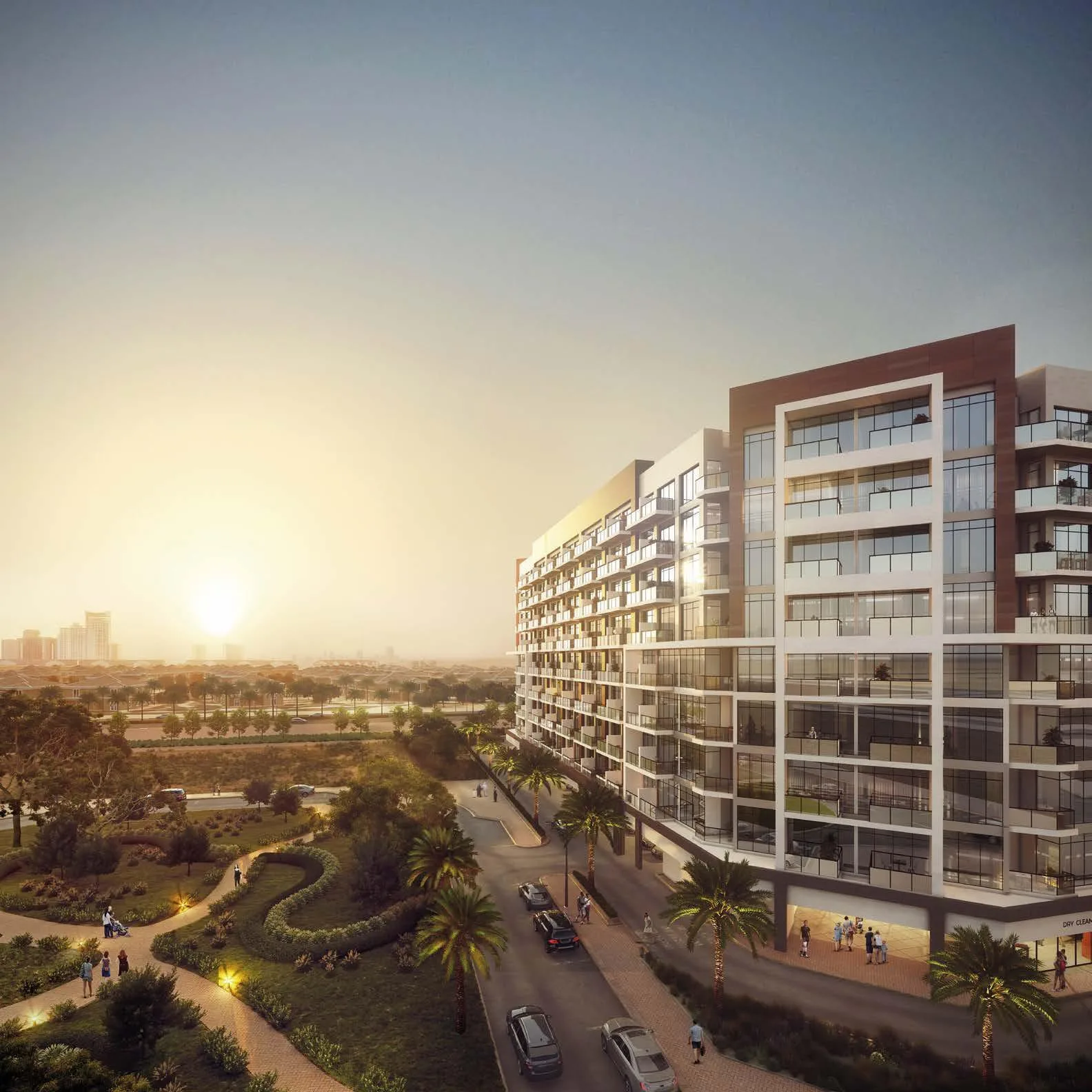 Корпус Beach Oasis у парка с дорожками, вдали город на закате