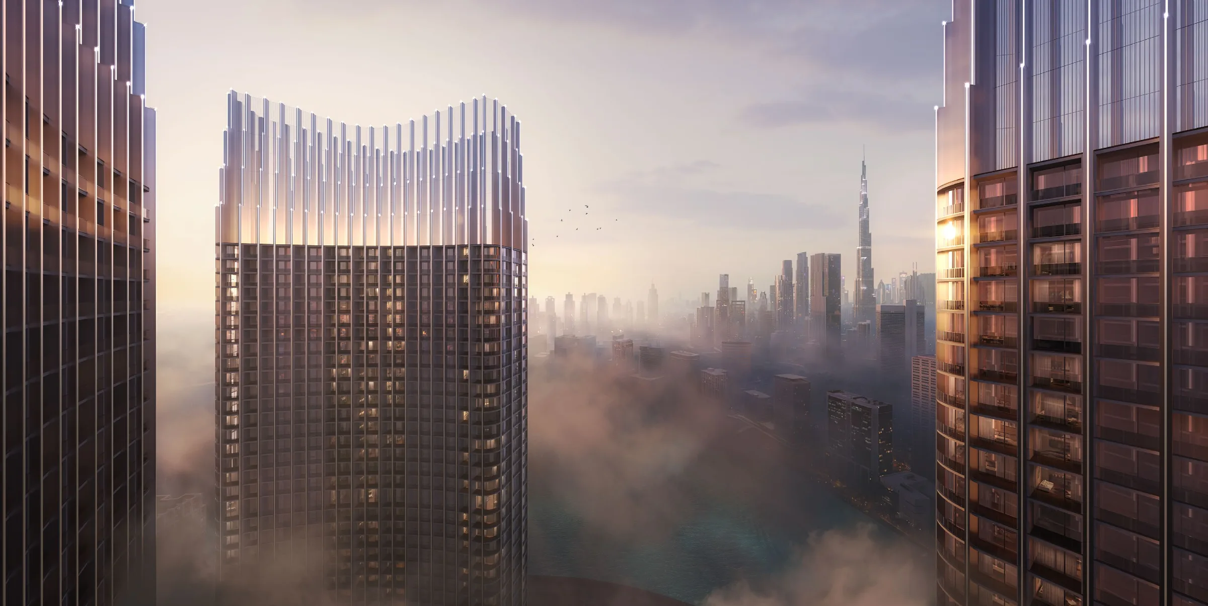 Верх башни Binghatti Skyrise над утренним туманом, вдали Бурдж-Халифа