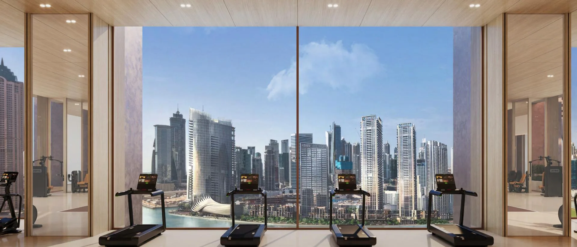 Фитнес-зона Burj Capital с беговыми дорожками у окна