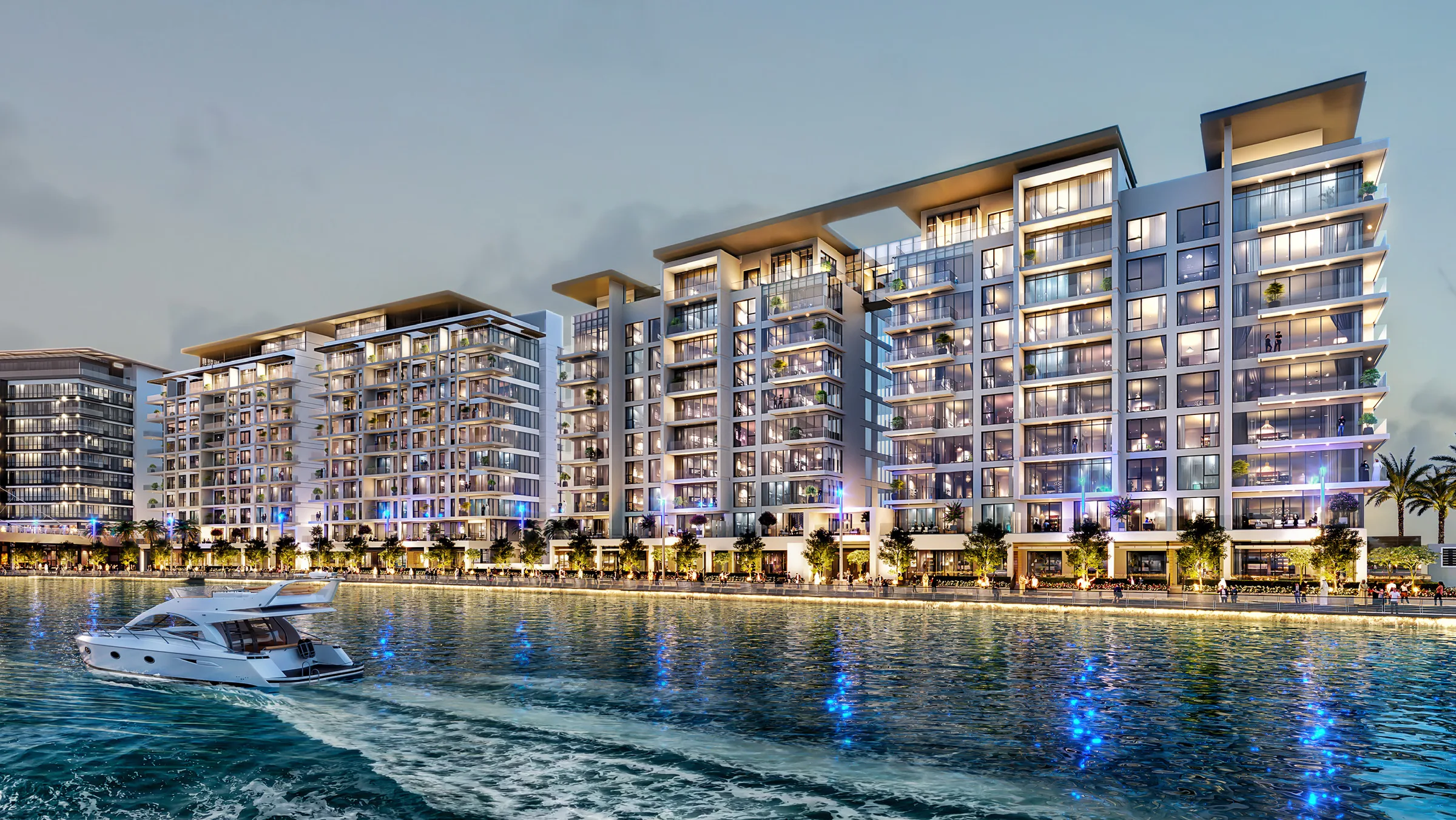 Дома Canal Front Residences на берегу канала вечером