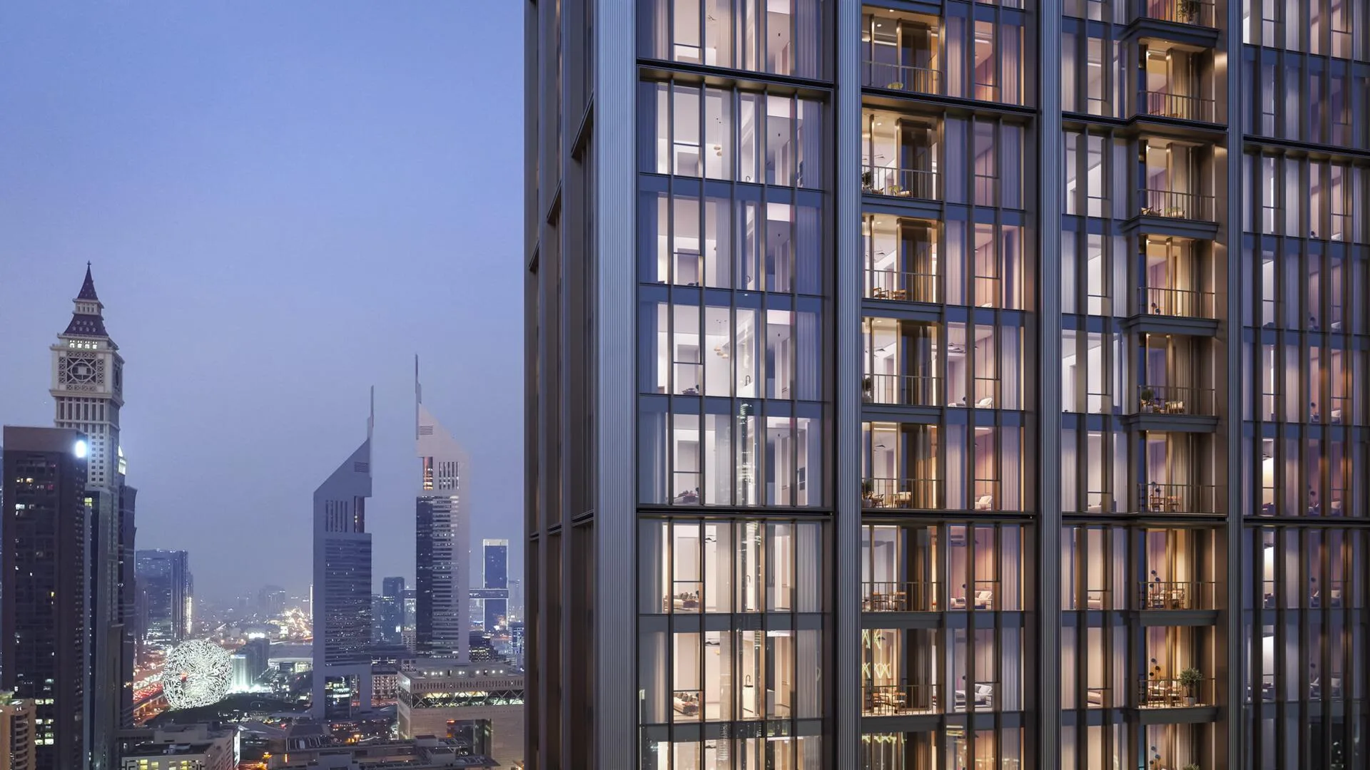 Фасад DIFC Heights Tower вечером рядом с Emirates Towers
