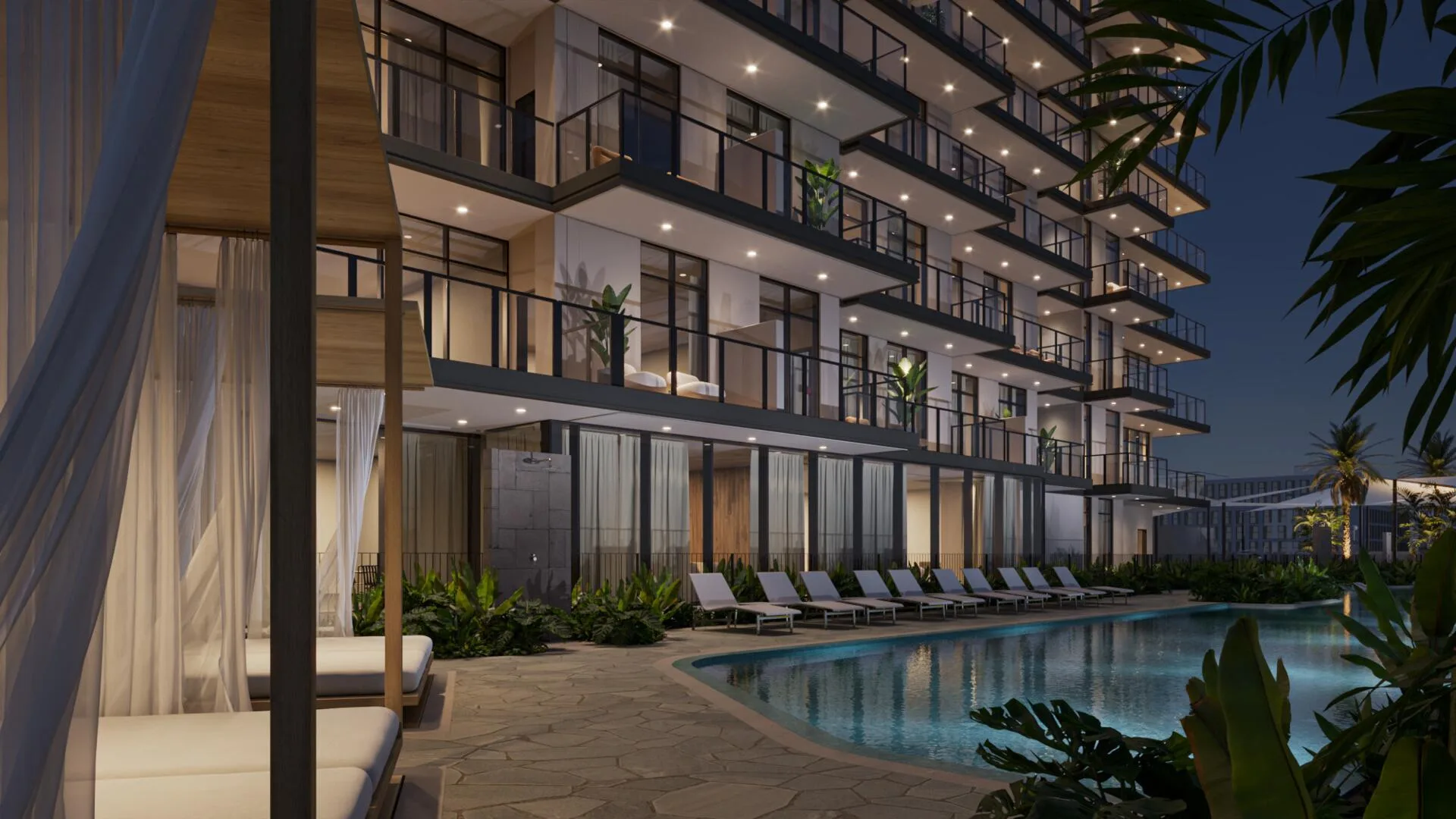 Бассейн DoubleTree by Hilton Residences вечером, подсвеченные балконы и лежаки