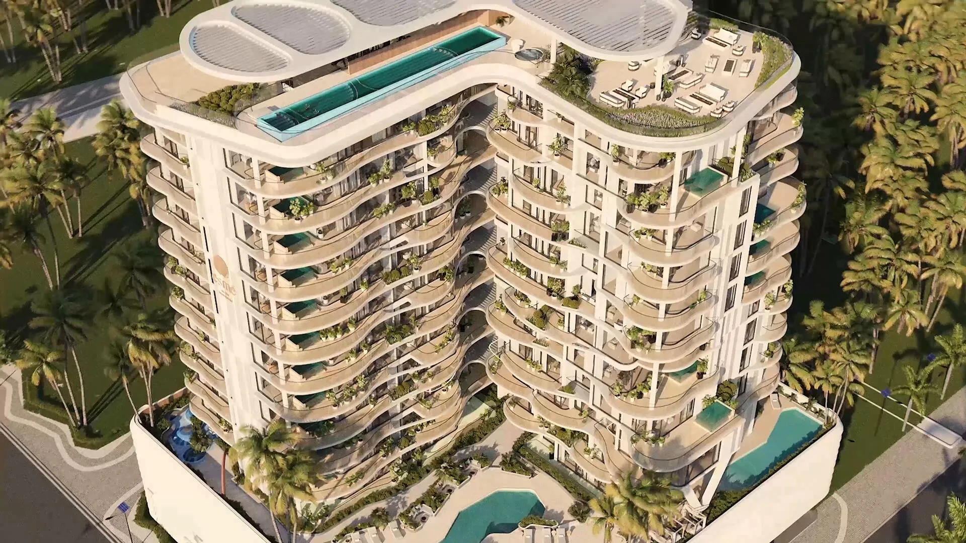 Дом Esmé Beach Residences сверху: бассейн на крыше и изогнутые балконы