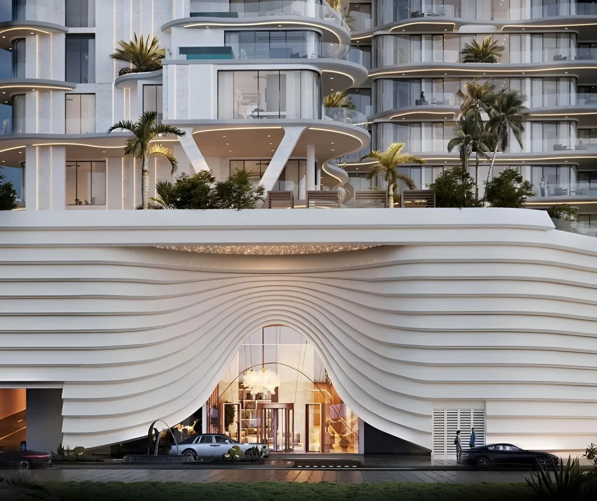Вход в Esmé Beach Residences вечером: арка в волнистом подиуме