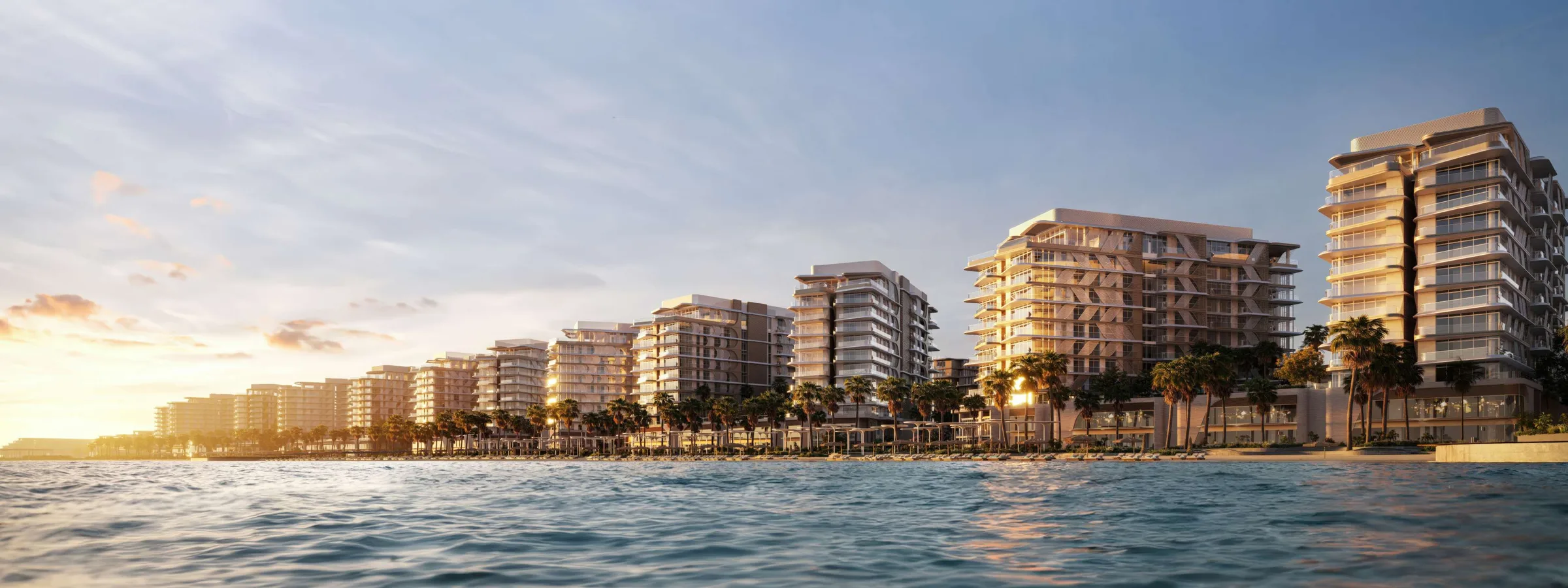 Дома Fahid Beach Residences вдоль берега на закате, вид с воды