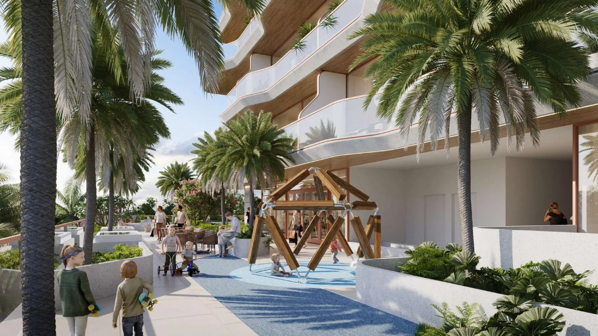 Двор Flow Residences с пальмами и детской площадкой