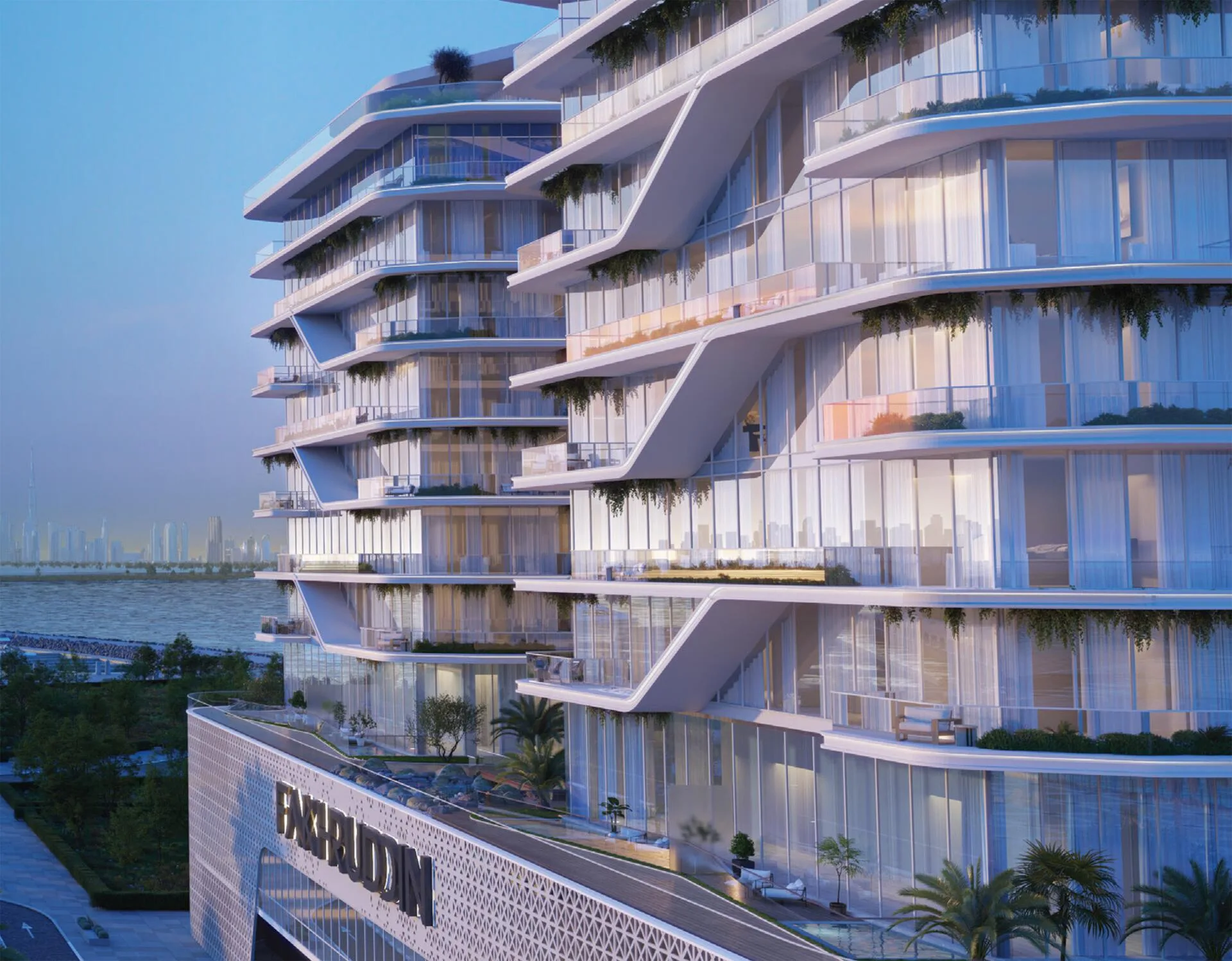 Фасад Hatimi Residences вечером, вдали вода и город