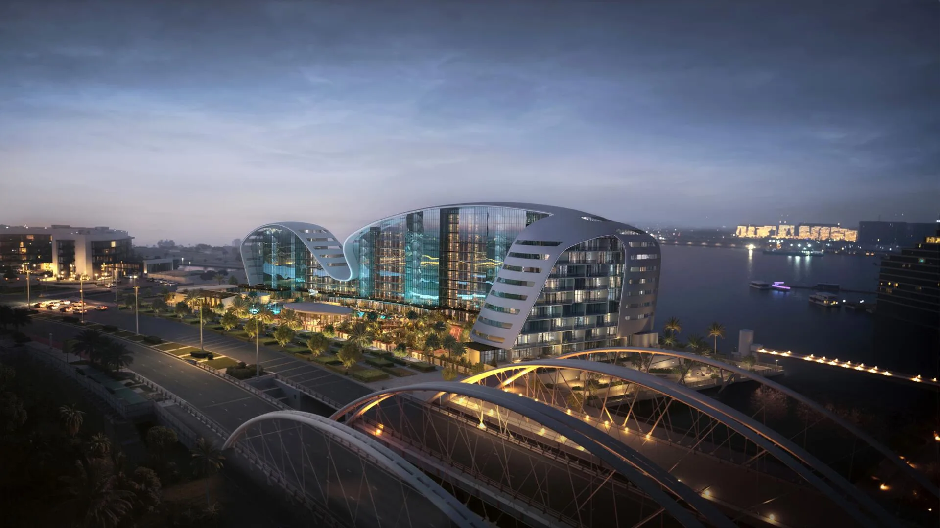Hilton Residences вечером: арочный мост, дорога и вода Al Raha