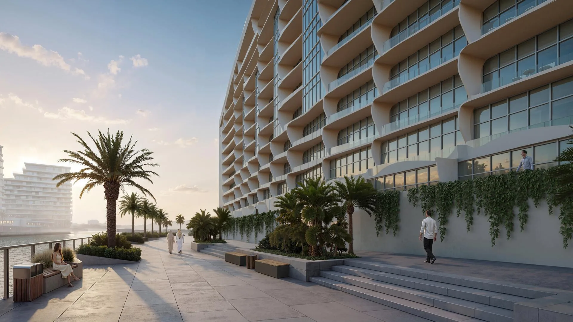 Набережная у Hilton Residences: пальмы, скамьи и фасад с балконами