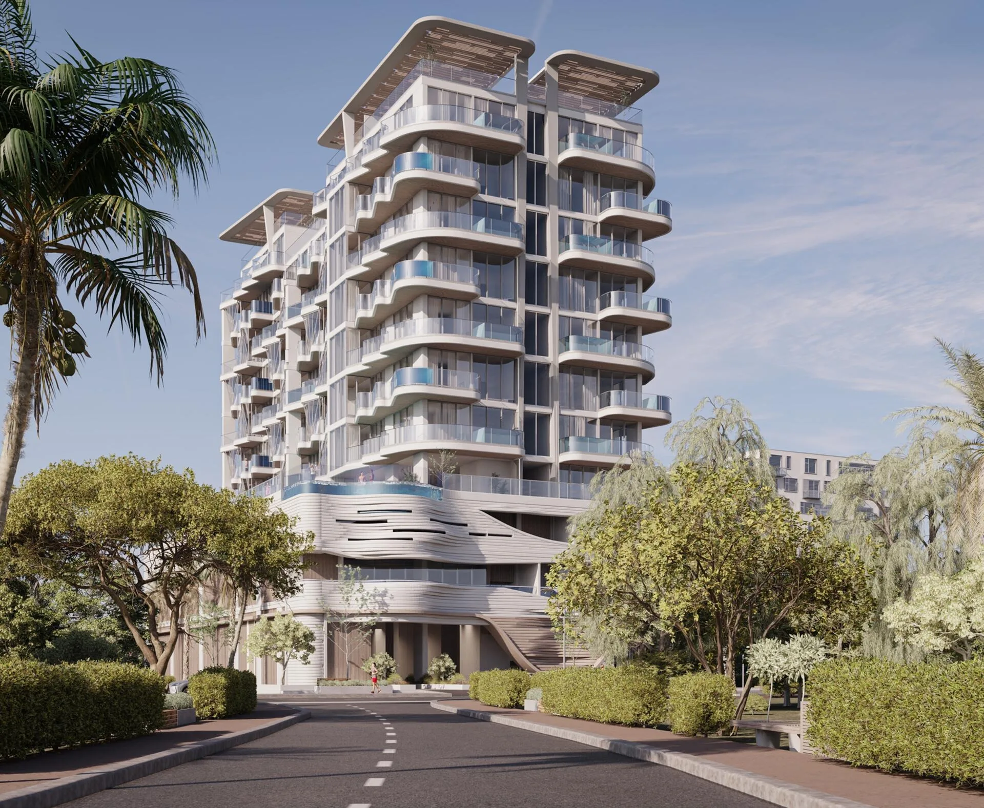 Iluka Residences с улицы среди деревьев
