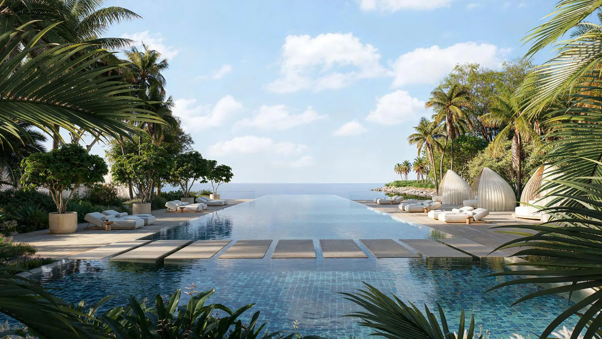 Бассейн инфинити Jumeirah Asora Bay среди пальм, уходит к морю