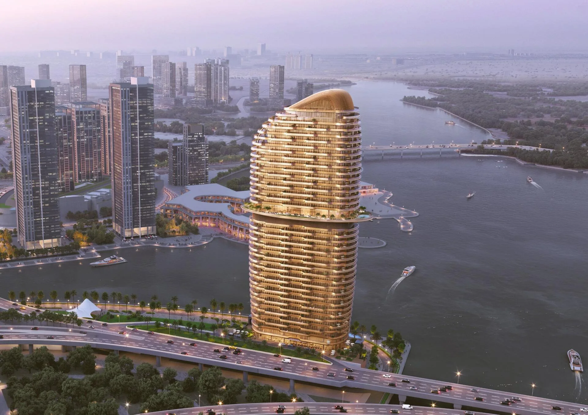 Янтарная башня Jumeirah Residences над водой на закате