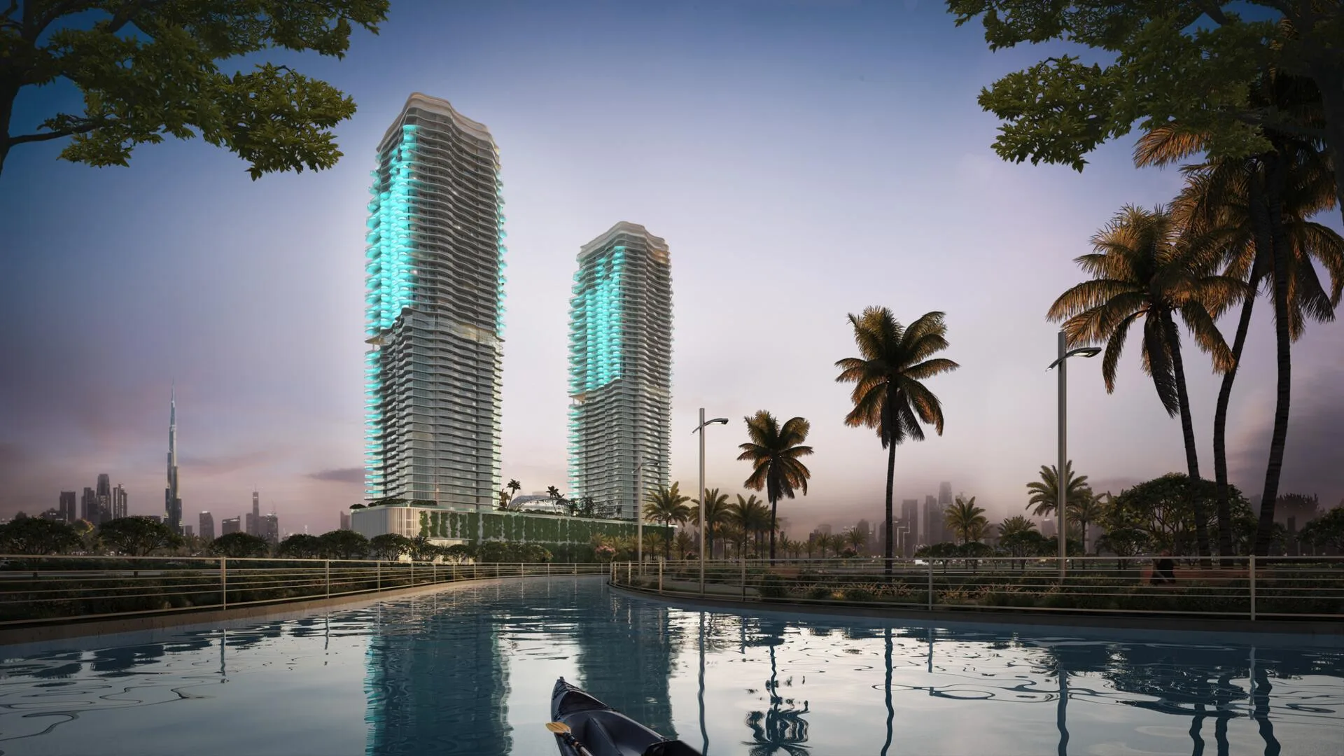 Две башни Laguna Residence вечером, вдали Бурдж-Халифа