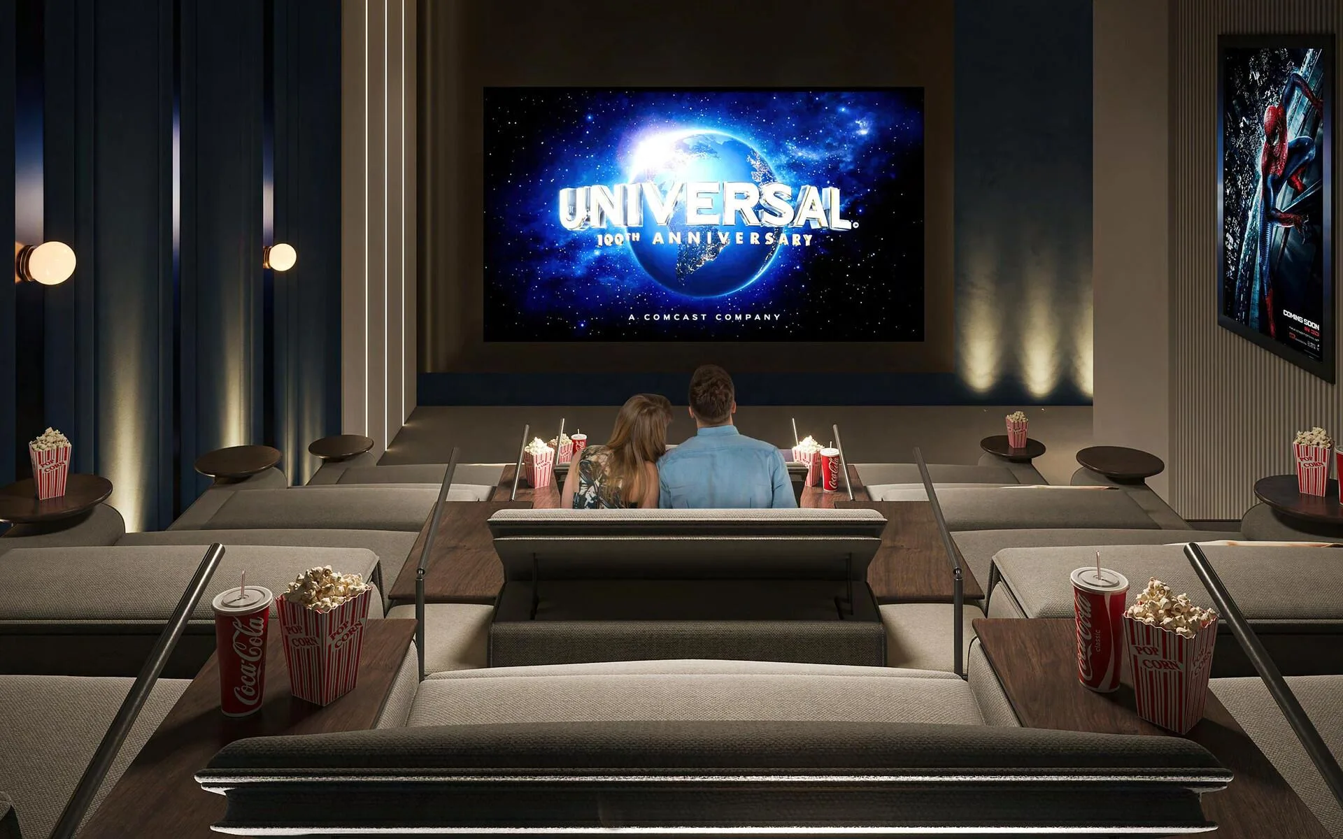 Cinema with a large screen, tiered rows of soft sofas and side tables