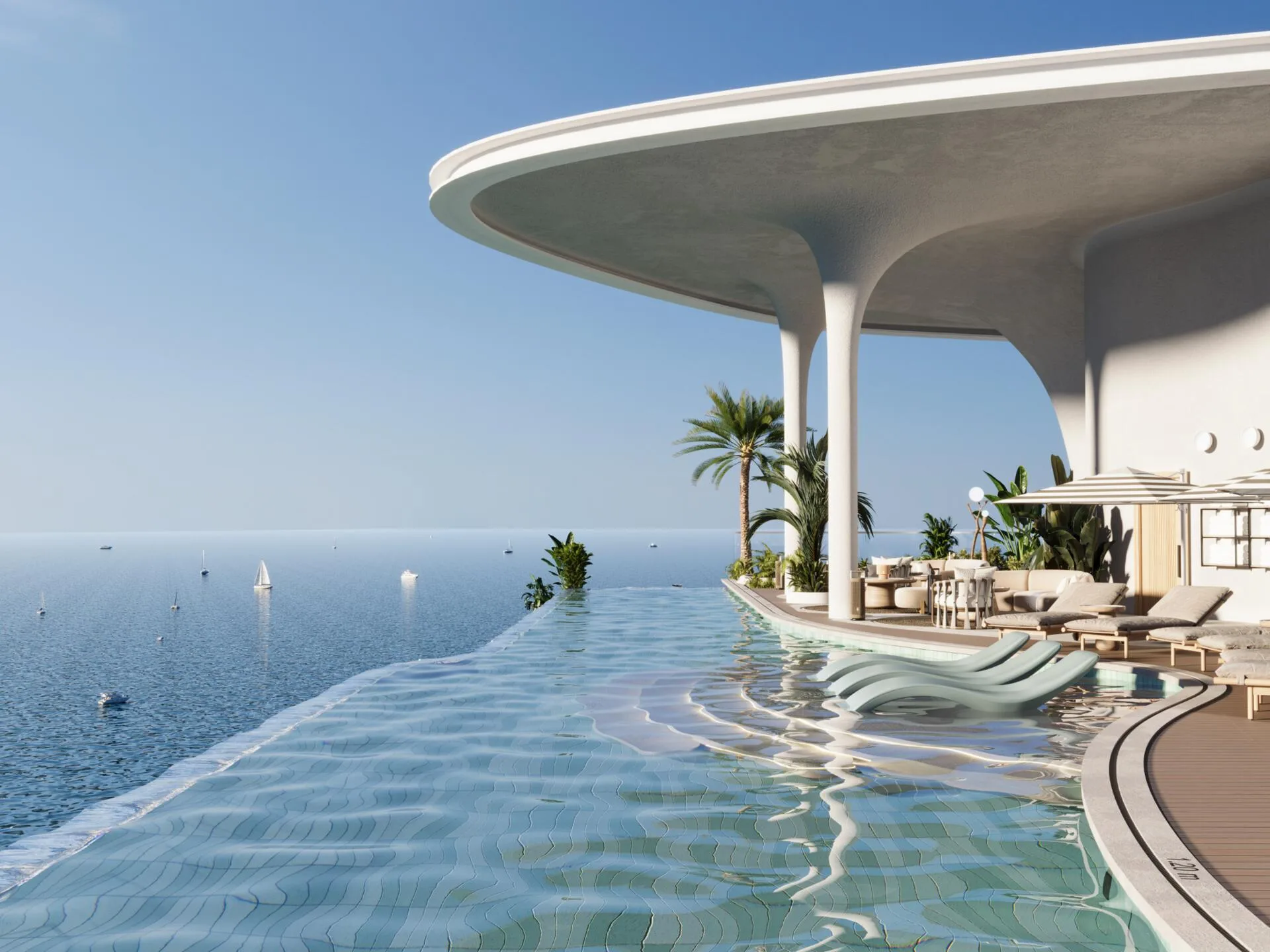 Rooftop infinity pool under a white canopy, with sea and sailboats beyond