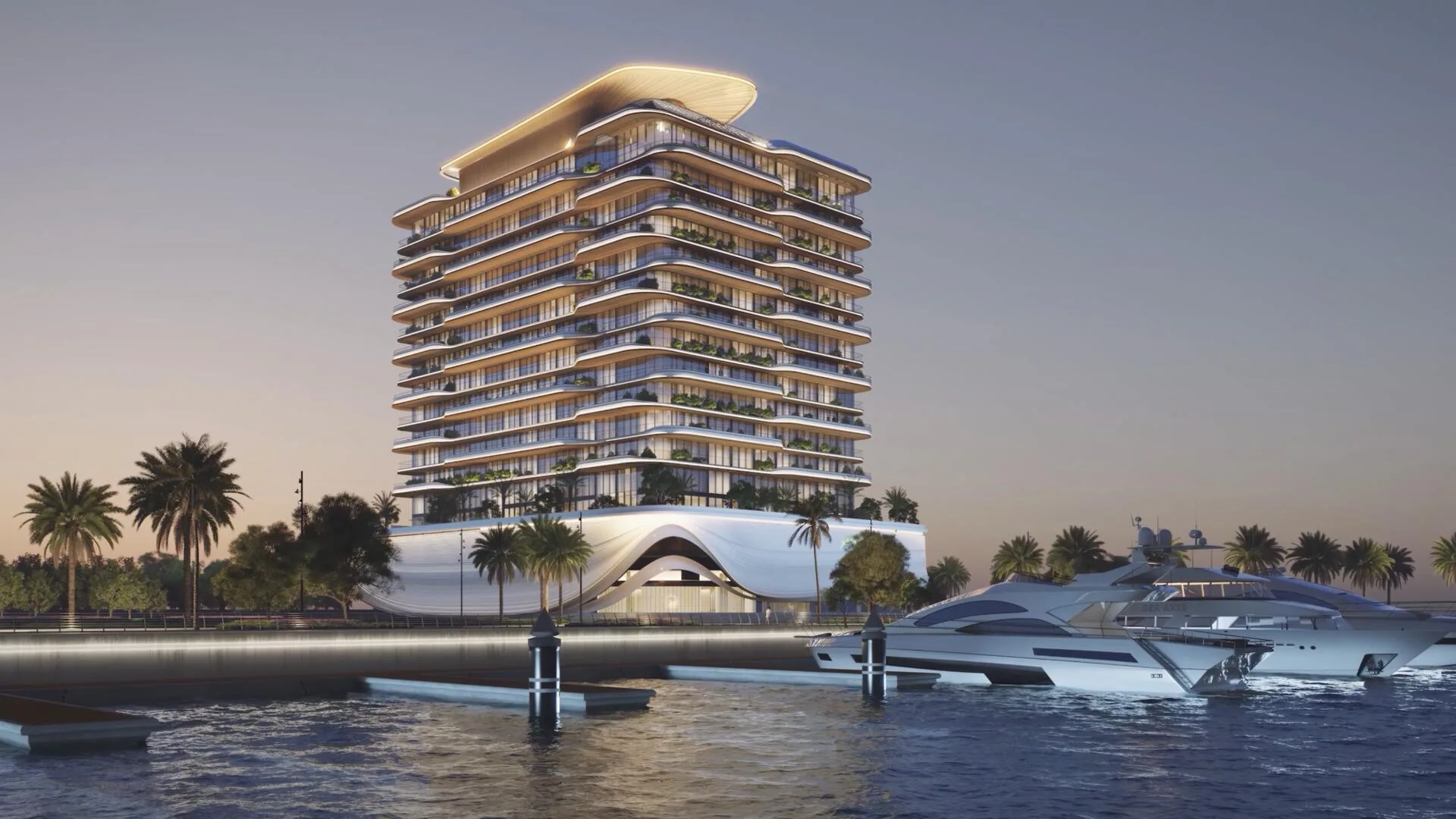 LIV Oceanside in the evening: a tower with wave-like terraces and a yacht at the berth