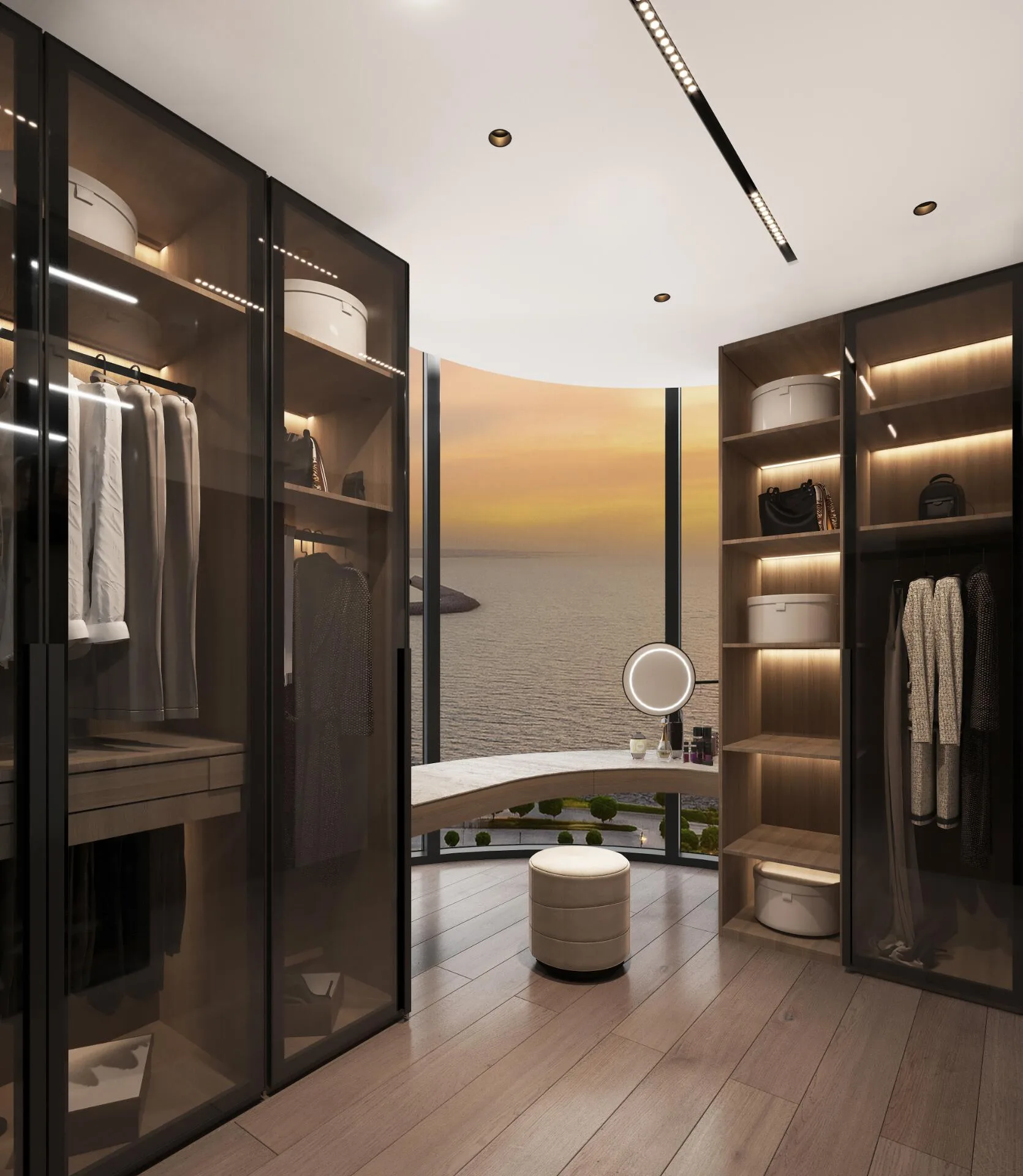 Dressing room behind smoked glass, with a curved sea-view window at sunset