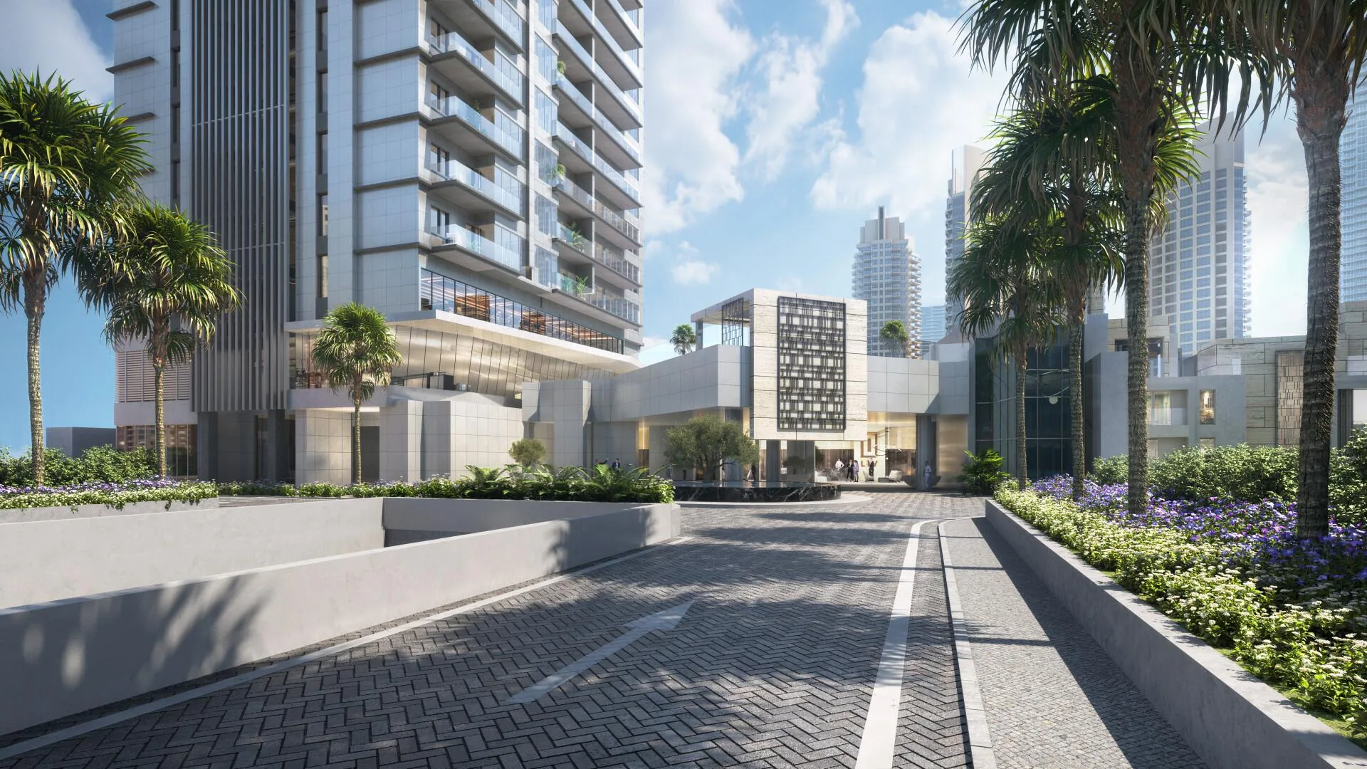 Подъезд к лобби LIV Waterside среди пальм и цветов