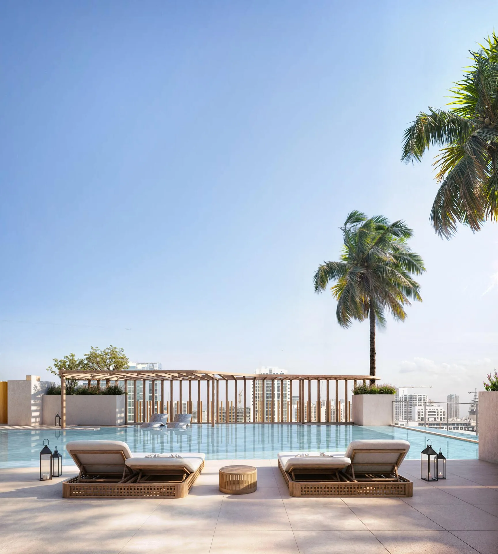 Бассейн Lume Residences с лежаками и пальмами