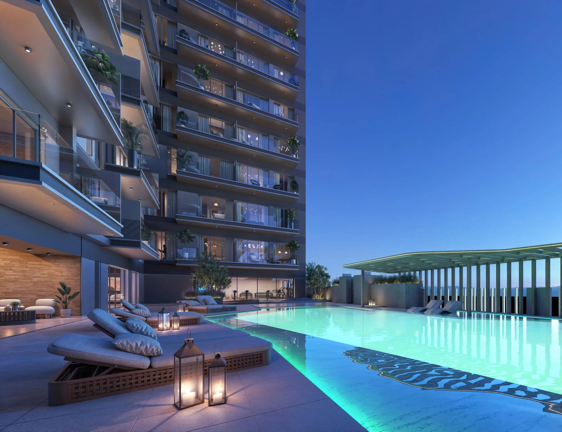 Бассейн Lume Residences вечером у подножия башни