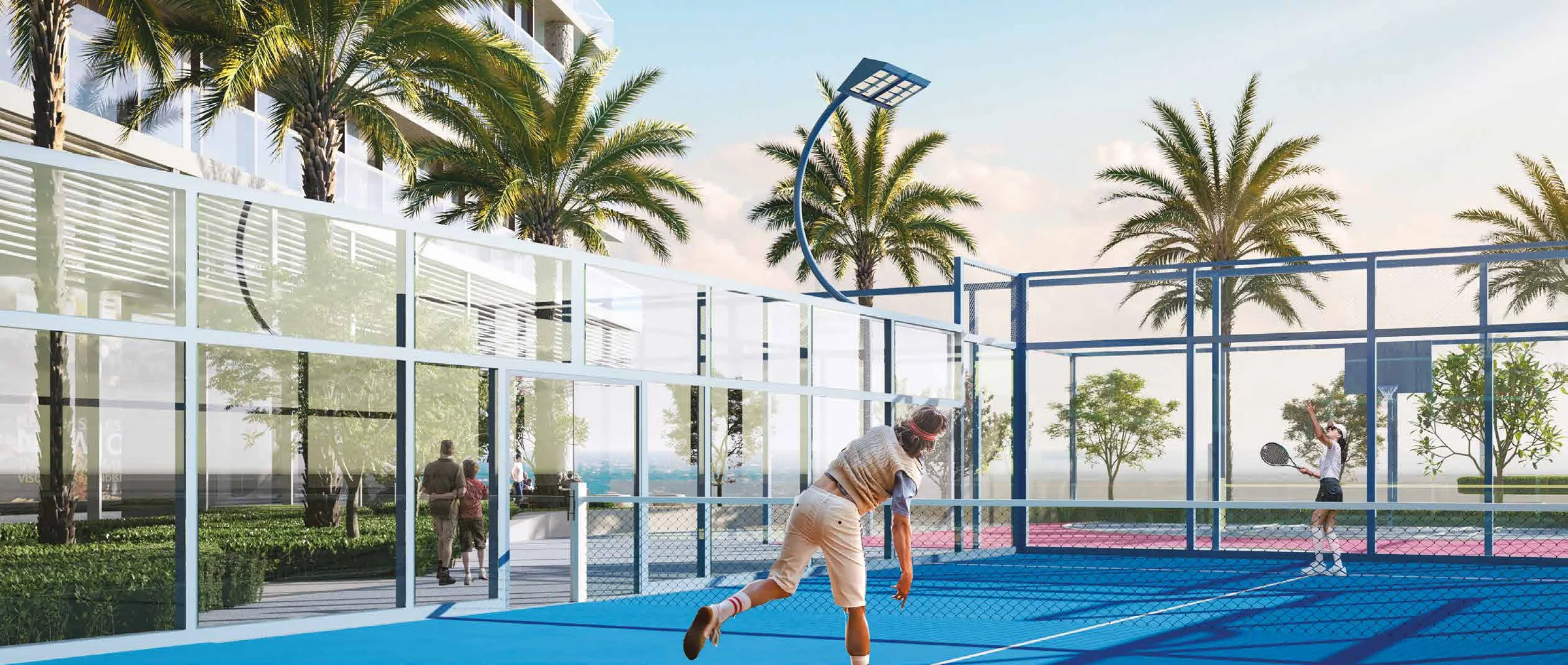 Playing on a padel court among palms beside the building