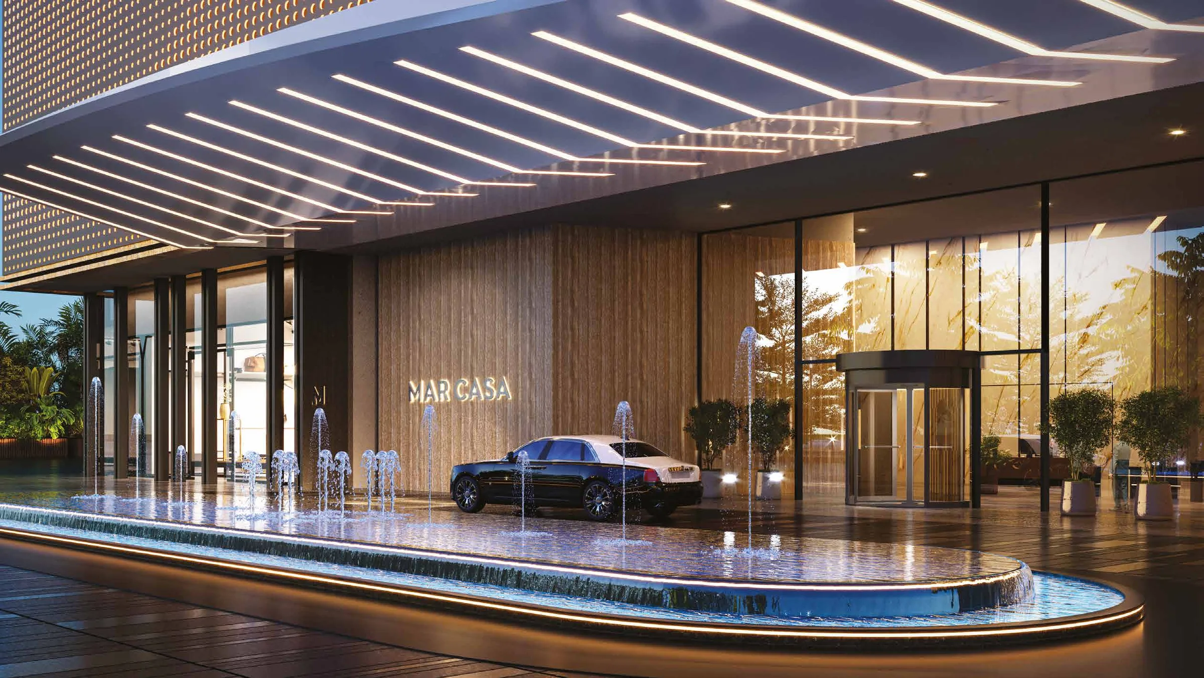 Evening arrival at Mar Casa with an illuminated canopy and fountains