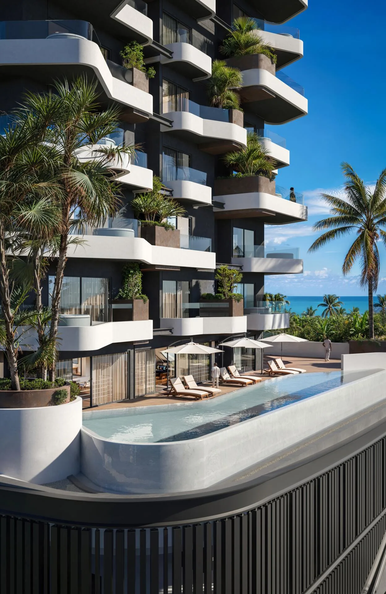 Бассейн Marea Residences с шезлонгами, вдали море