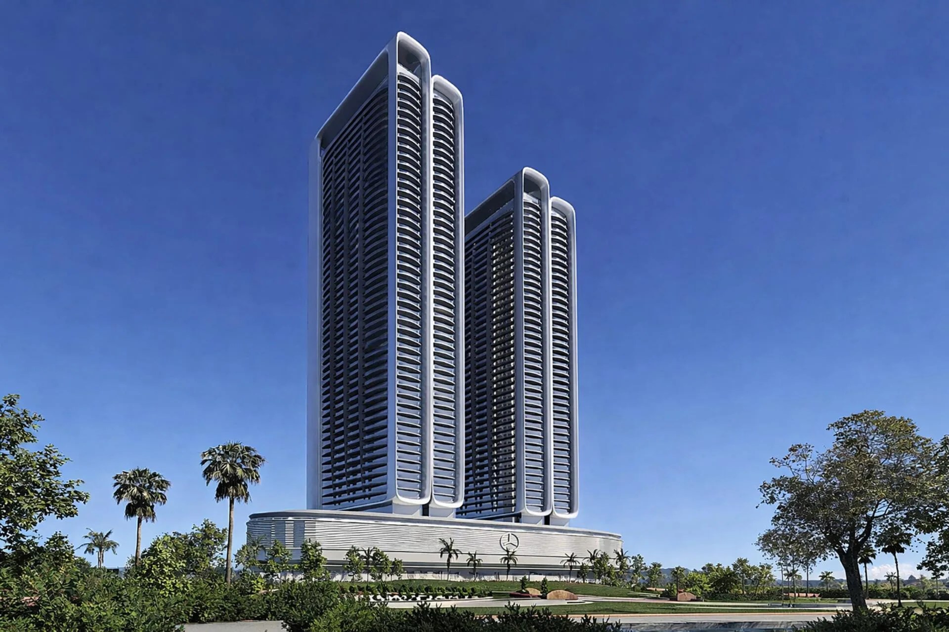 Две башни Binghatti City с общим основанием днём