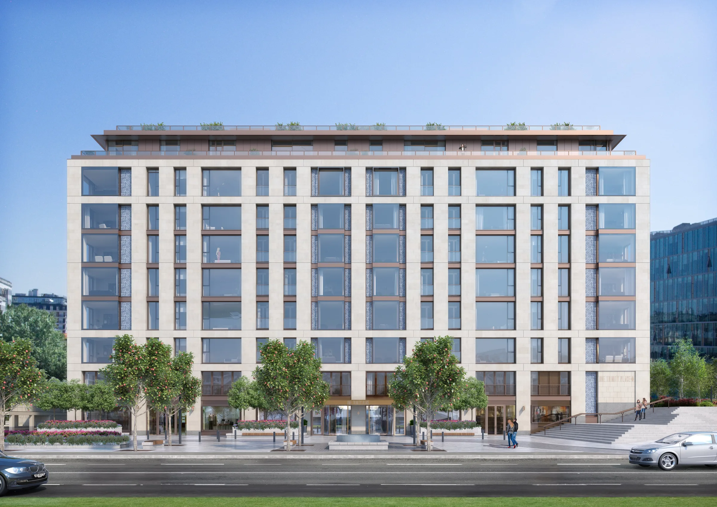 Фасад One Trinity Place со стороны набережной: светлый камень, ровный ряд высоких окон, деревья у главного входа и ступени к плазе справа