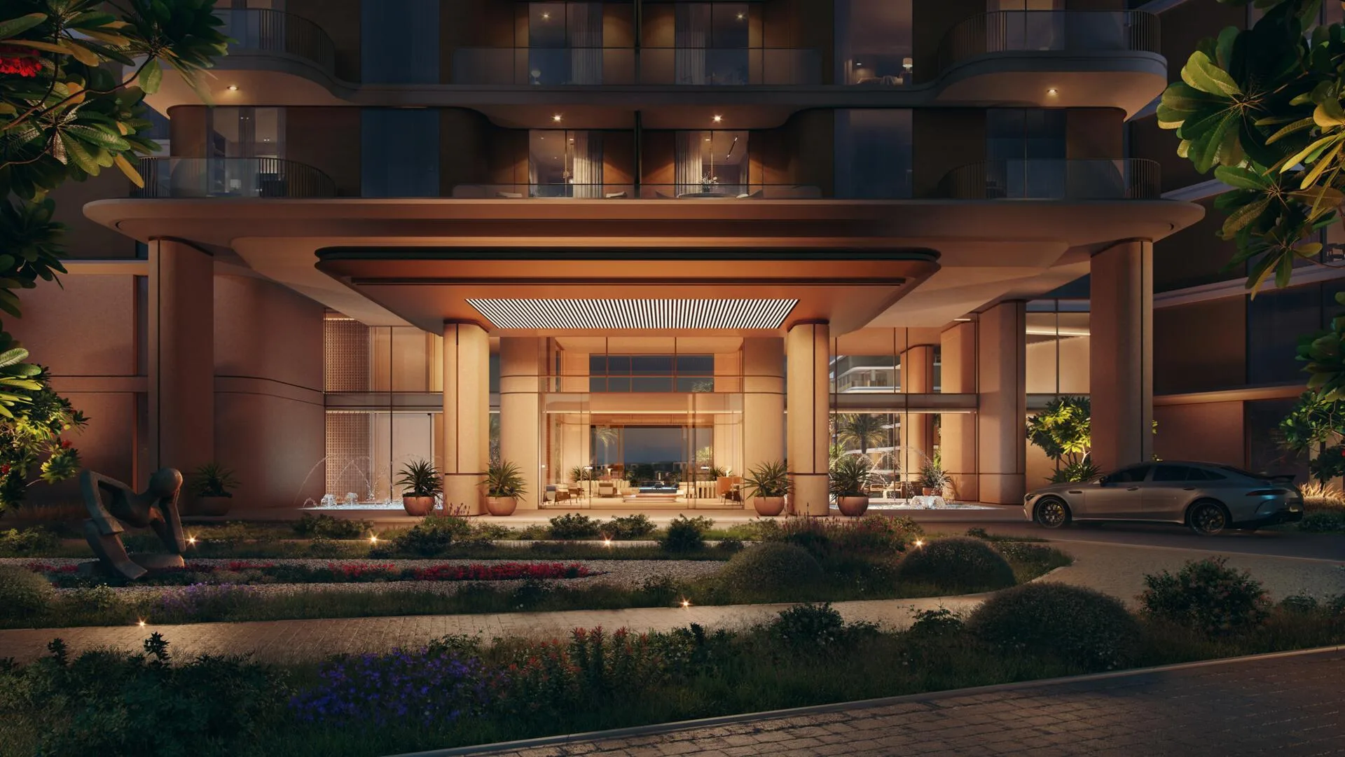 Вход в дом Palm Central вечером, зона высадки в саду