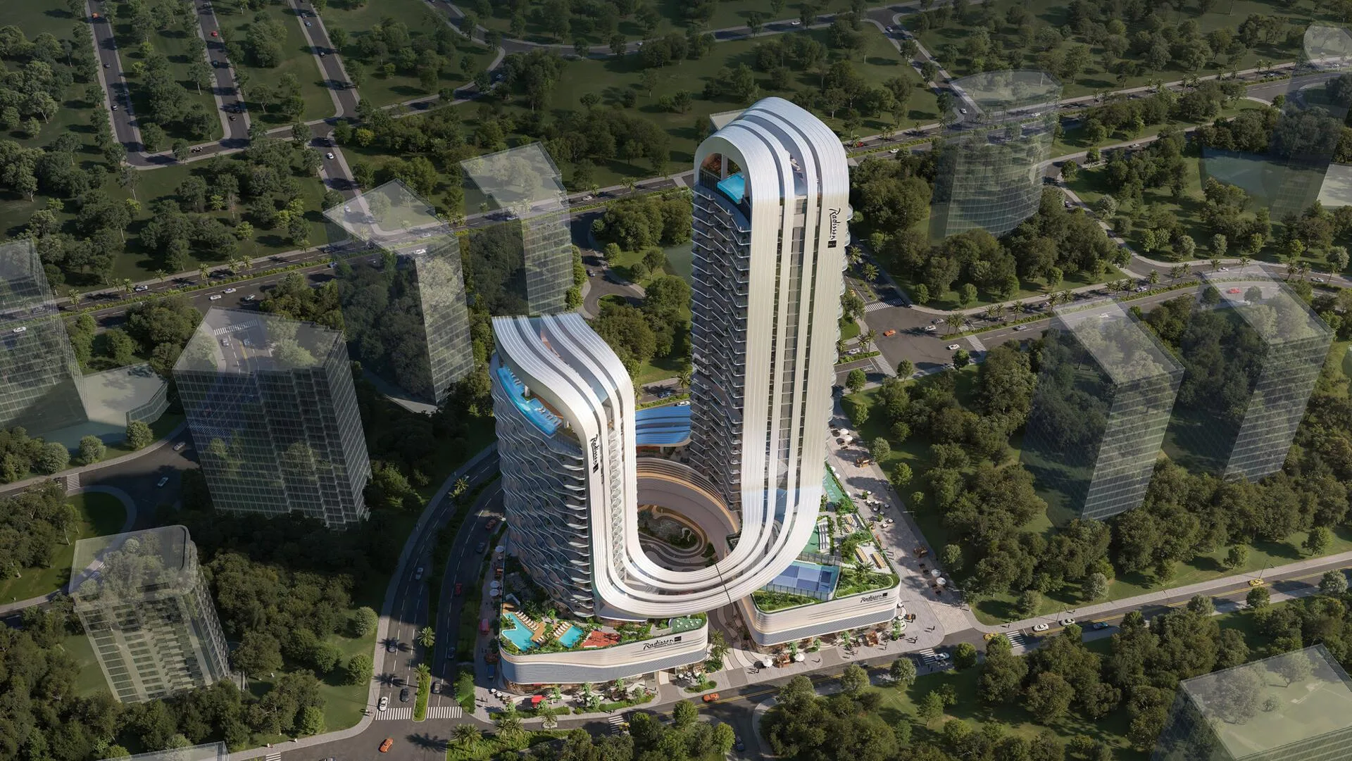 Radisson Blu RAK Central сверху среди зелени