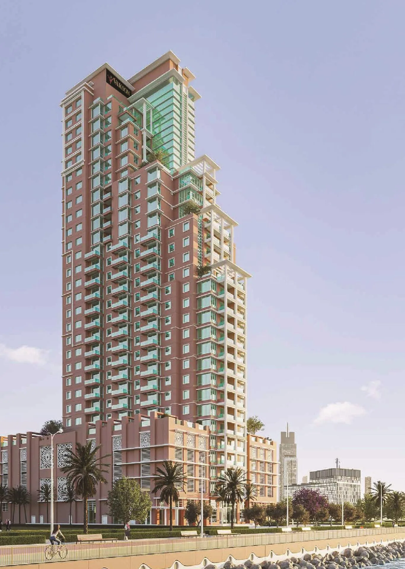 Башня Riva Residence днём: терракотовый фасад и набережная с велодорожкой