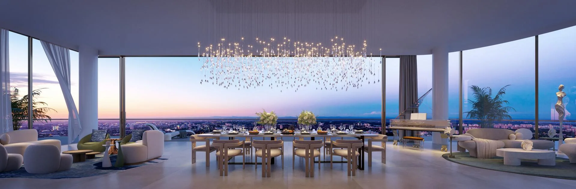 Гостиная Sky Palace с длинным столом под люстрой и видом на закат