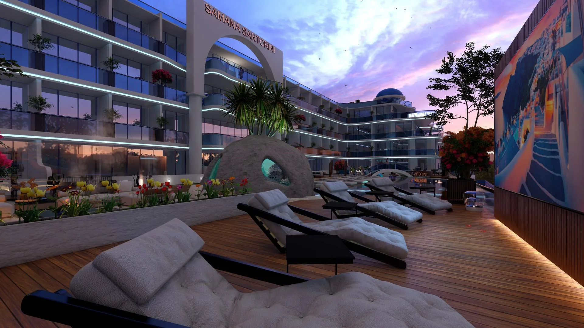 Лежаки у воды в Samana Santorini на закате
