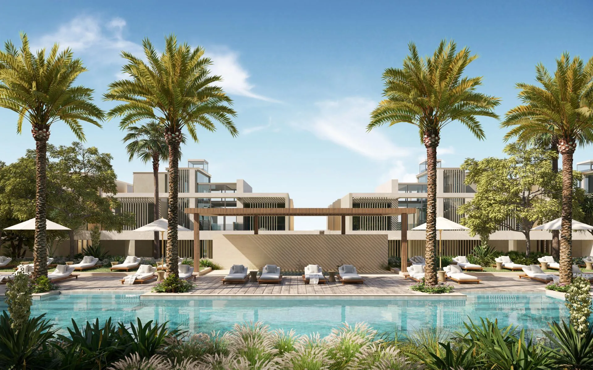 Бассейн с шезлонгами и пальмами в Six Senses Residences