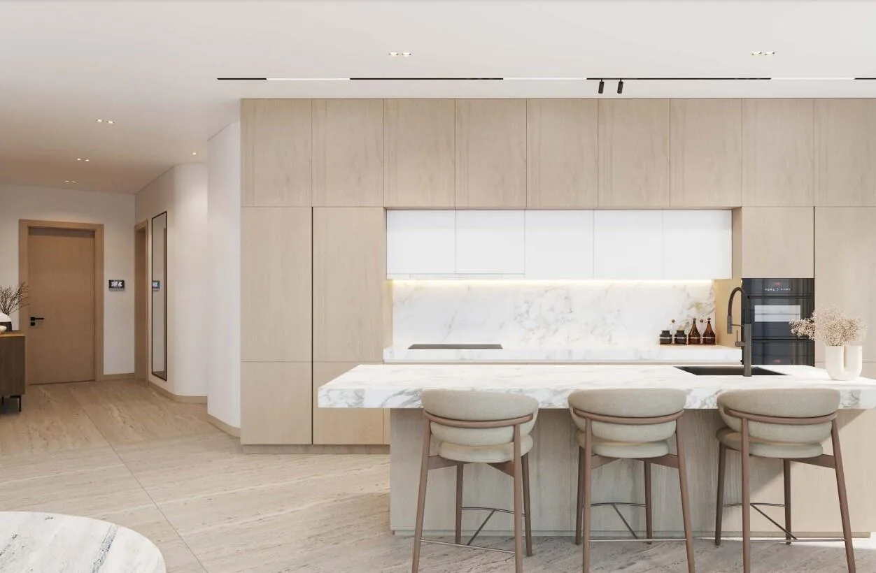 Кухня с островом и светлыми фасадами в квартире The Beach Residences