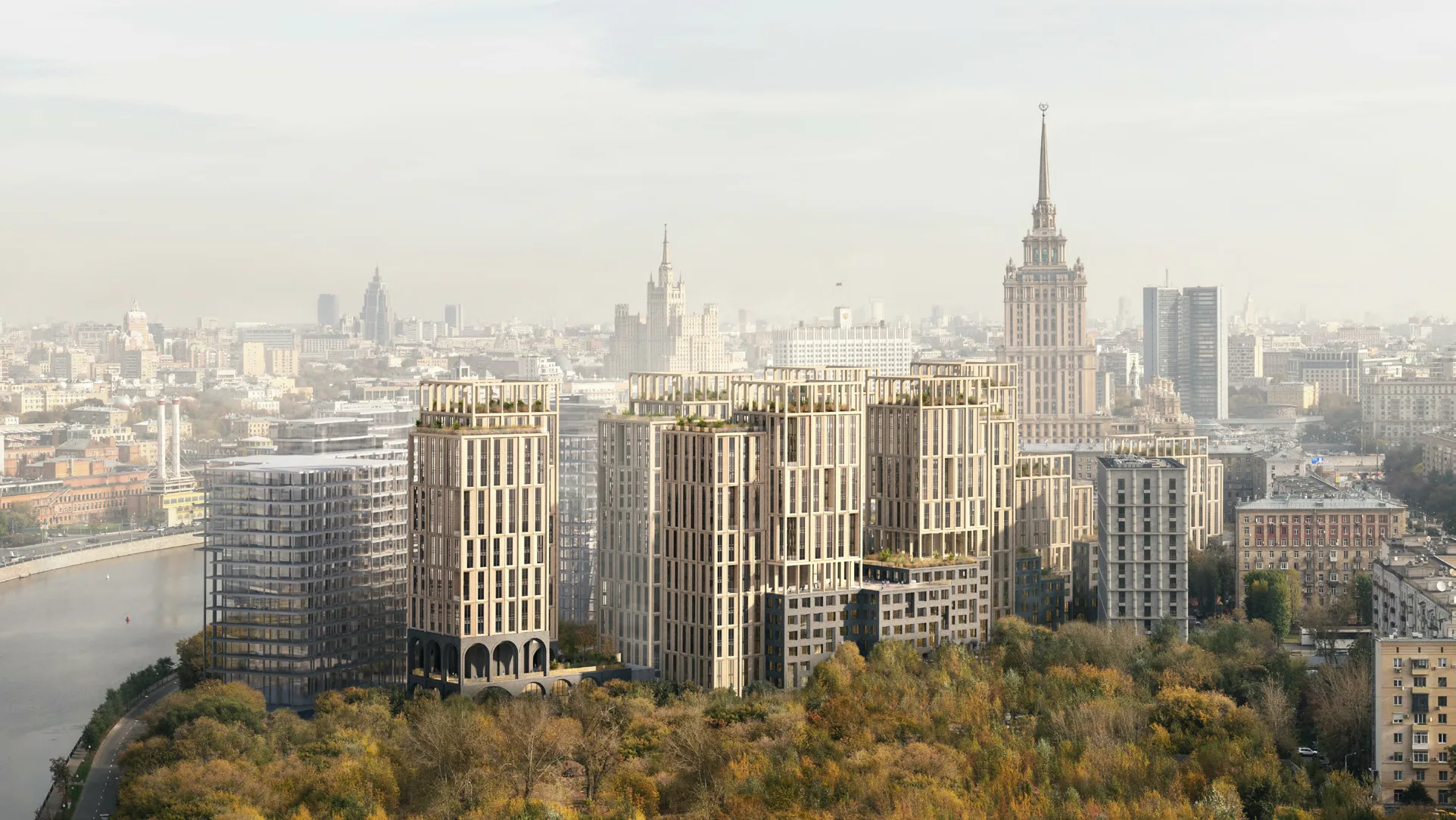 Корпуса квартала над осенним парком у Москвы-реки, за ними высотка и центр города