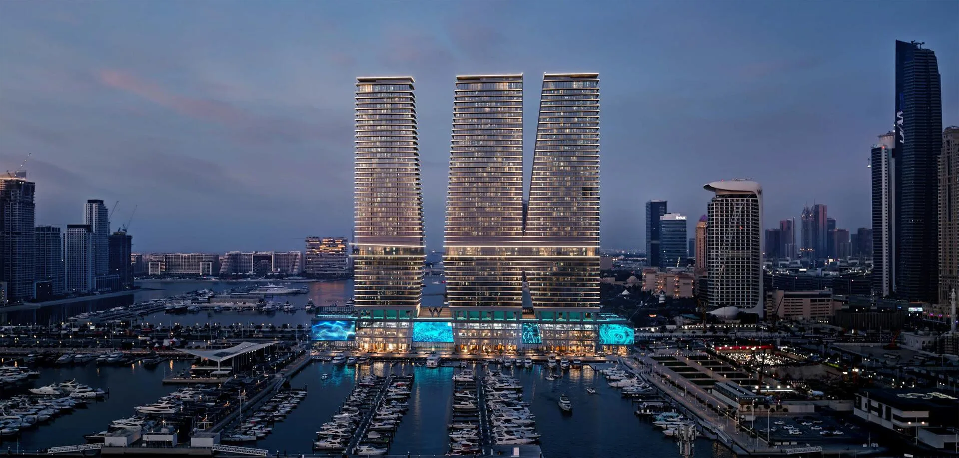 Башни W Residences над яхтенной мариной Dubai Harbour вечером