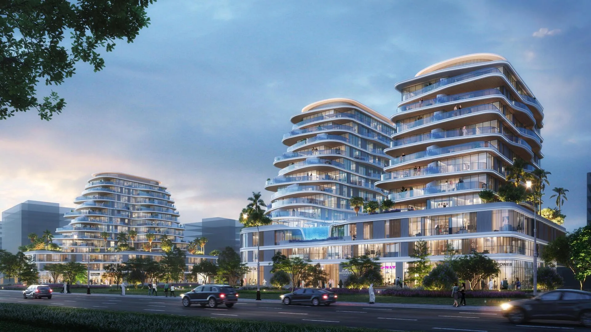 Здания Zephyra Residences с улицы вечером